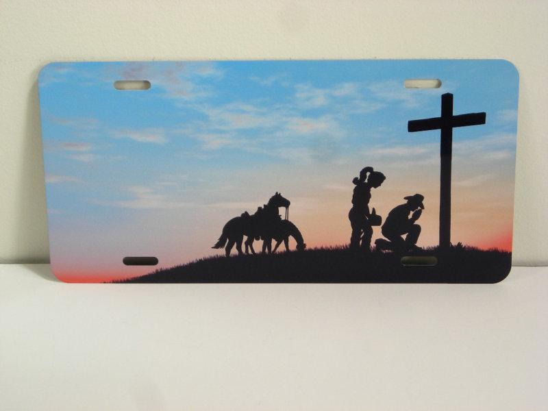 Cowgboy & cowgirl  praying at cross w/ horse metal vanity license plate car tag