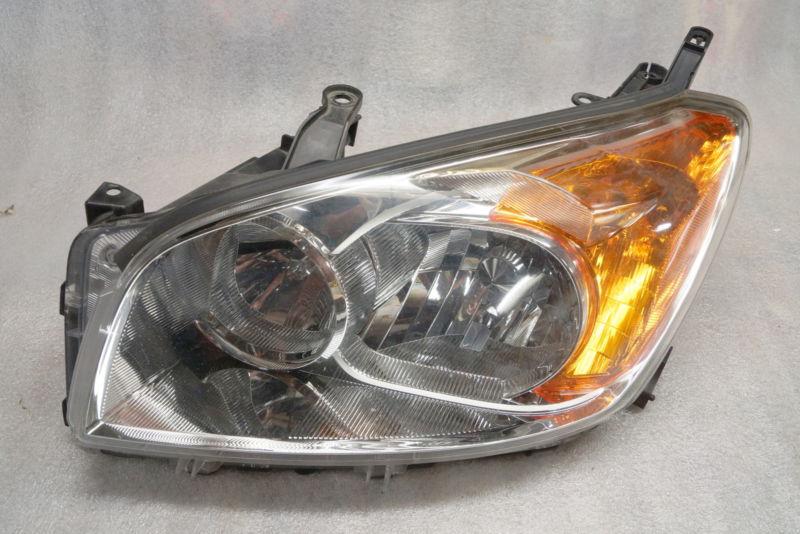 2009-12 toyota rav4 limited left headlight. good used oem lamp.