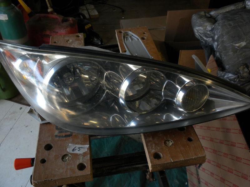 2005 toyota camry headlight o.e.m.