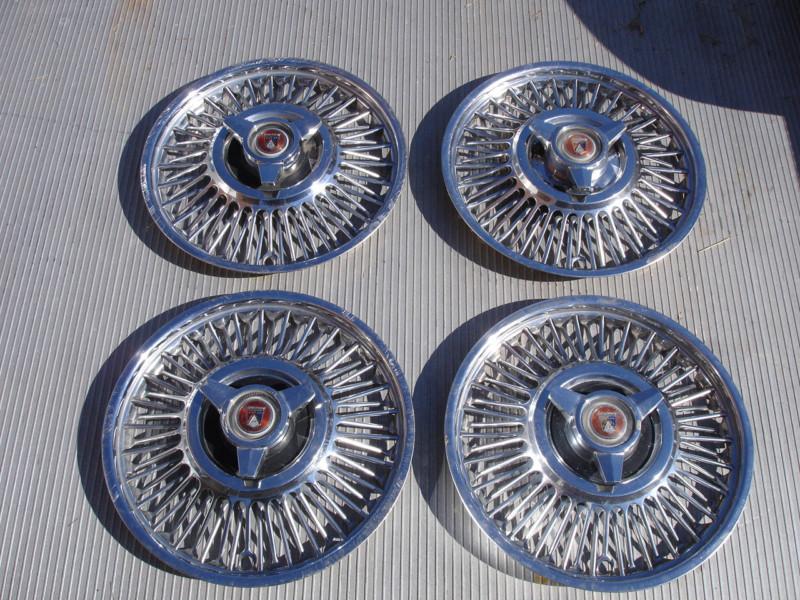 Set of 4 used 63 64? ford falcon sprint wire spinner hubcaps original equipment 