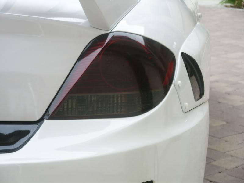 Smoked taillight overlay tint film tuscani fits: hyundai tiburon