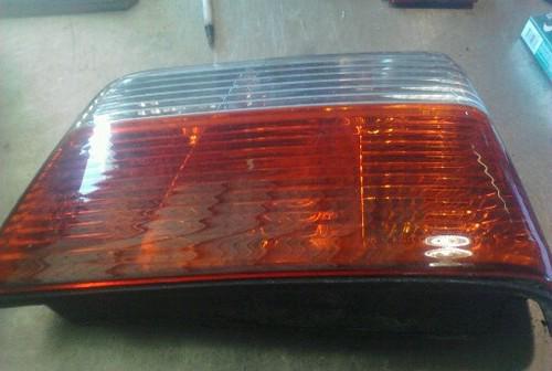 A passenger side tail light from a 1996 bmw 325i