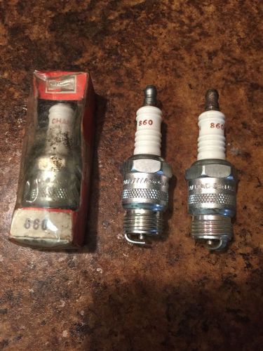 Three 860 champion spark plugs