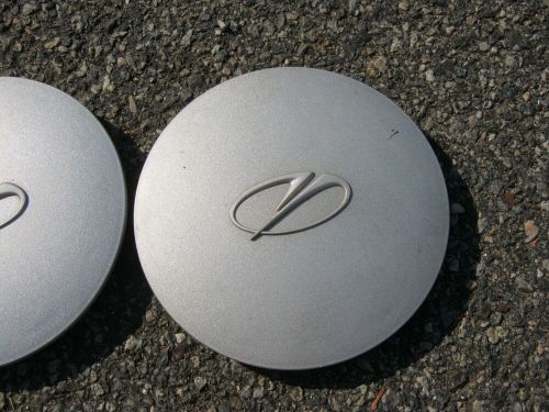 Genuine 1996 to 1999 oldsmobile 88 alloy wheel center caps hubcaps