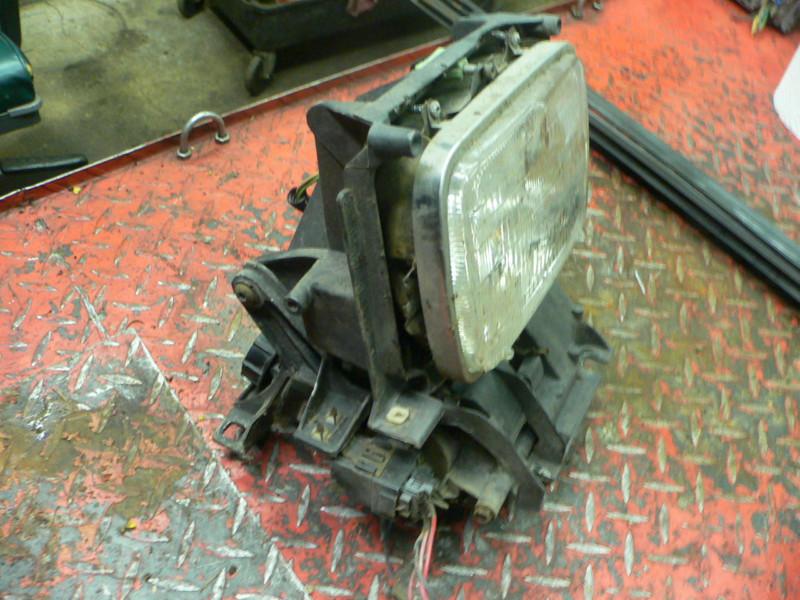 84 pontiac fiero left headlight assembly with motor, tested & working