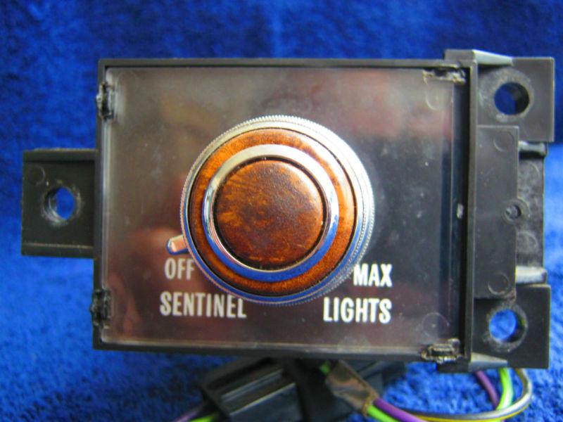 79 deville fleetwood auto dimming twilight headlight switch emblem / oem