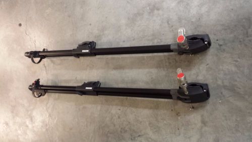 Pair of yakima forklift bike racks with locks rooftop universal mount