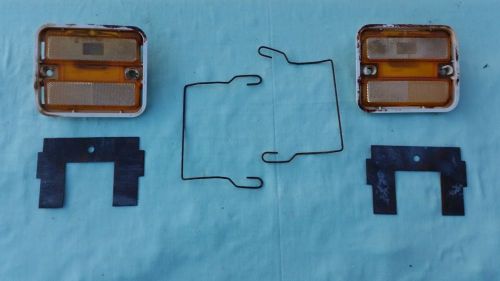 Side marker lights, back plates and clips form a 1971 pontiac lemans