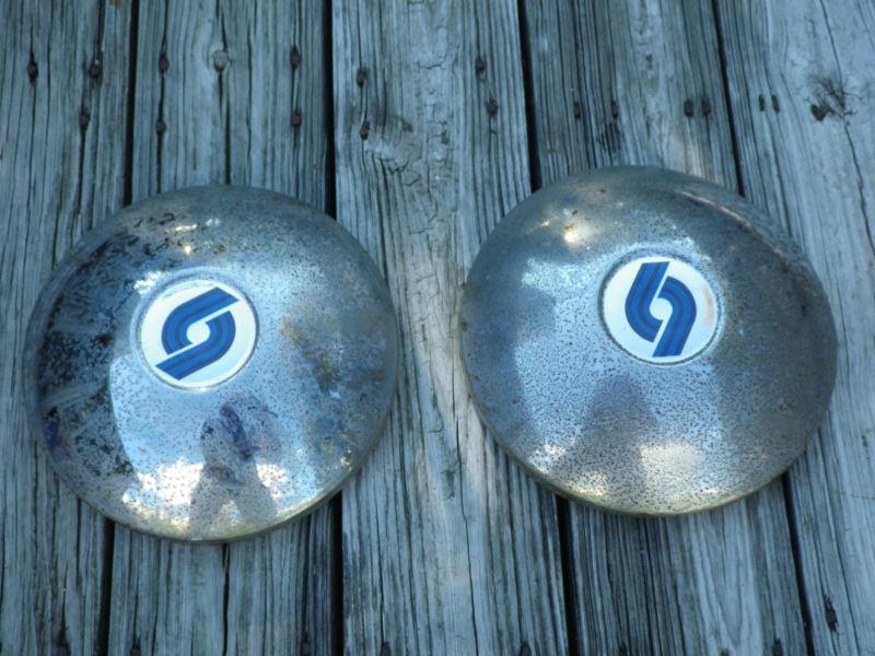 Vintage hub caps with blue swirl line logo - unknown manufacturer