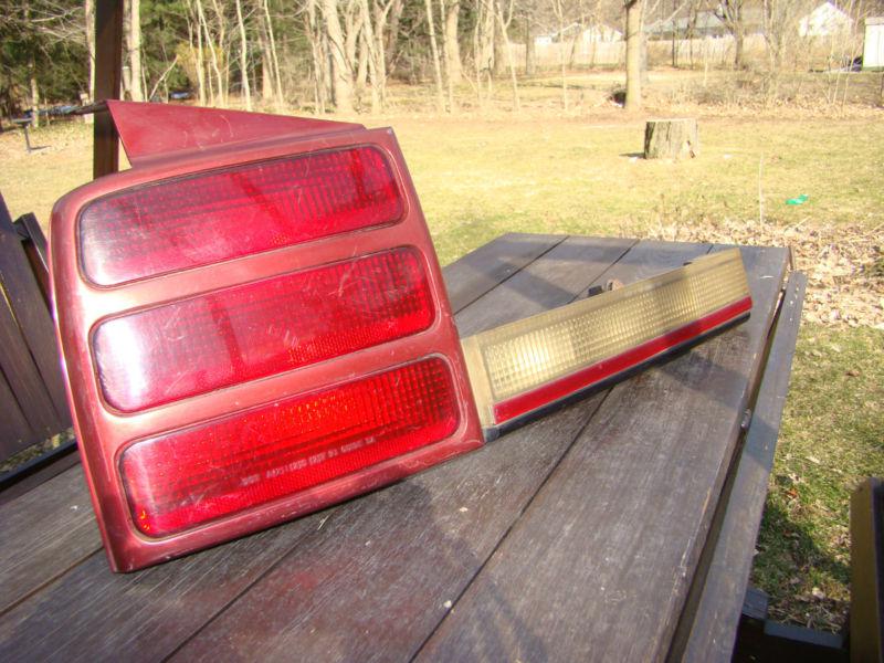 1990 to 1996 olds cutlass ciera tail and backup light left side.