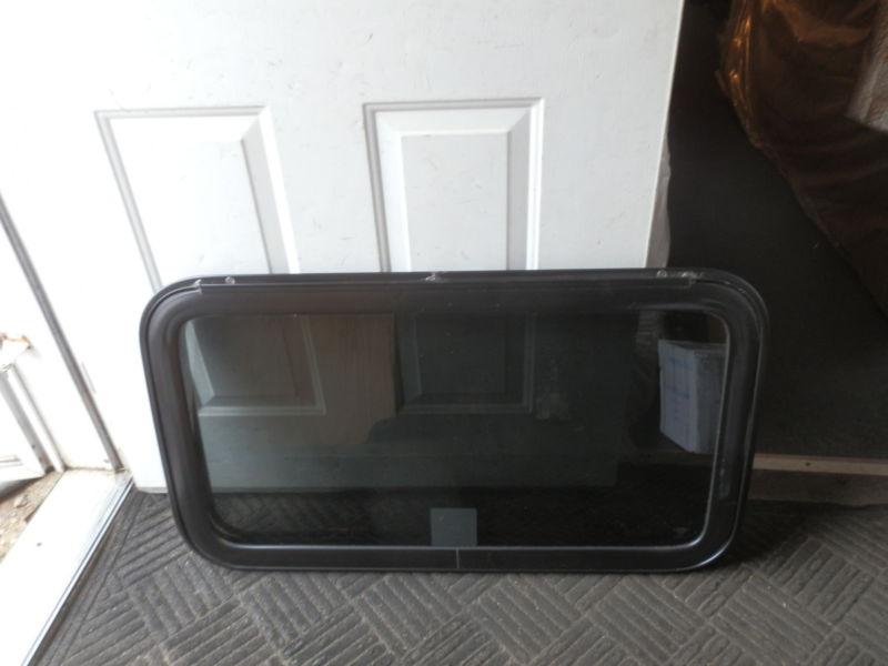 Rv black tinted emergency exit window r.o. 20" tall x 36" wide ( used )