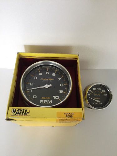 Auto meter 4898 carbon fiber 5&#034; tach in-dash electronic + 4891 2-5/8&#034; voltmeter