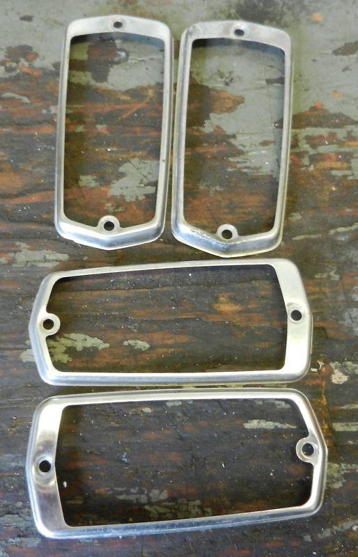 Datsun 240z 260z 280z  oem side marker lights trim frame $et of 4 