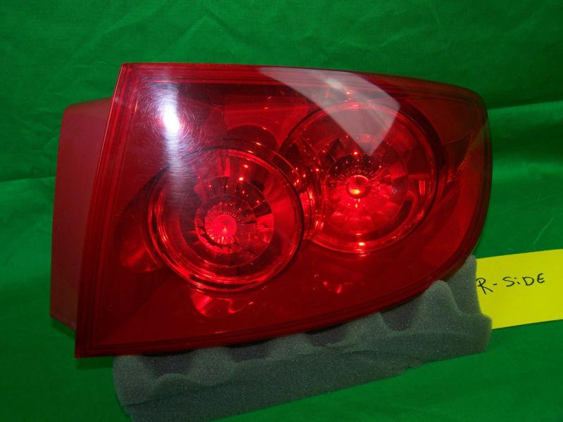 Used 2005 mazda 3 right side tail light with bulbs oem passenger side