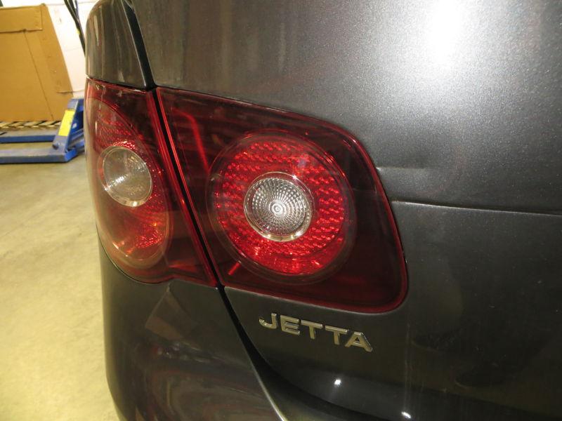 Driver side (left) tail light 2009 volkswagen jetta, lid mounted