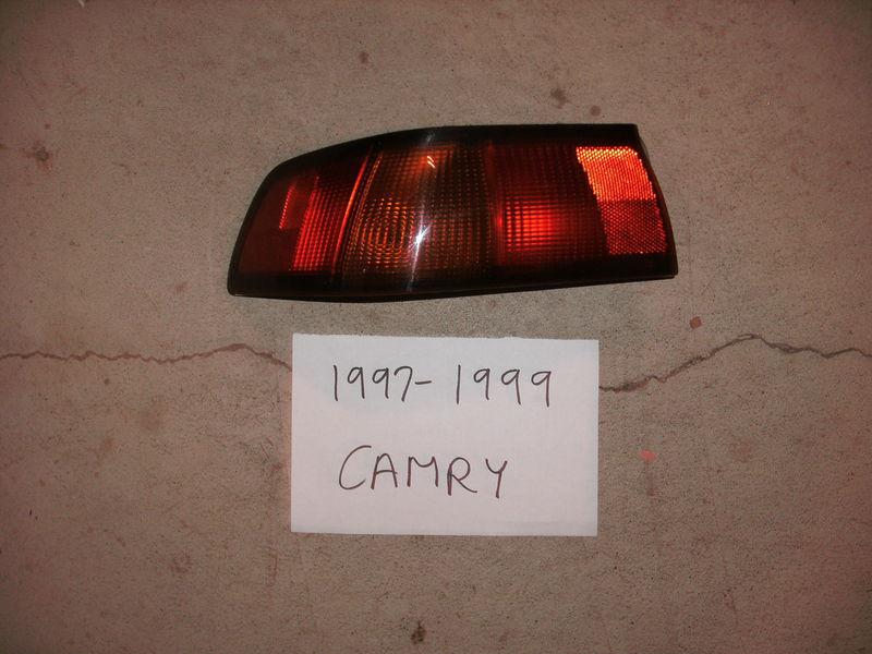 1997-1999 toyota camry drivers left factory taillight oem free shipping!