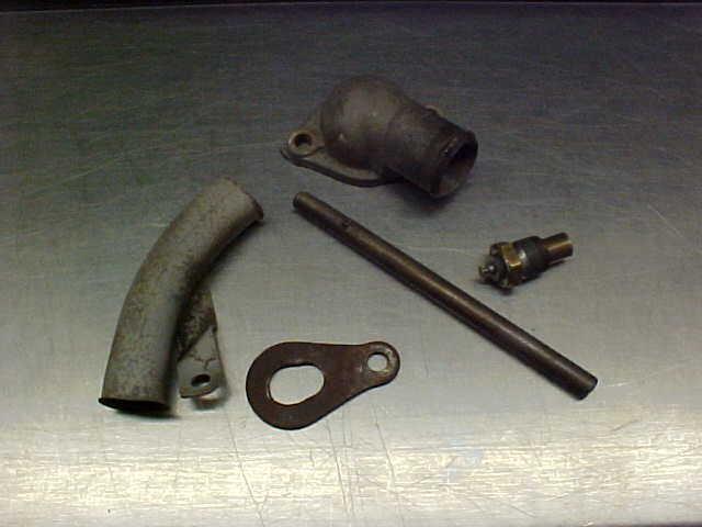 Pontiac water neck oil pump shaft hoist bracket starter cable shield