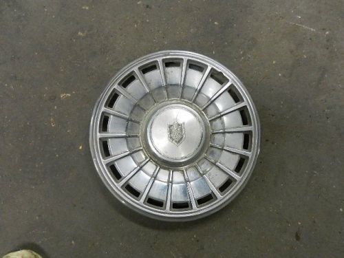 Used hubcap has crest on it (monte carlo maybe?), for 15 inch steel rim