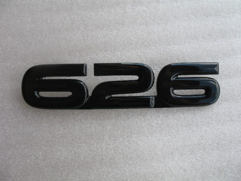 00-02 mazda 626 rear trunk lid painted black blacked out emblem badge decal logo