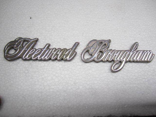 Cadillac fleetwood brougham emblem ornament " fleetwood brougham "   beige field