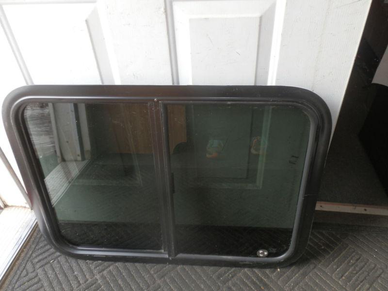 Rv black tinted slider window r.o. 30" x 22" 