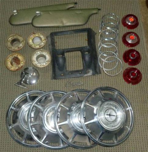 Corvair parts lot, mirror, tail lights hub caps, sun visors, dash part, emblem