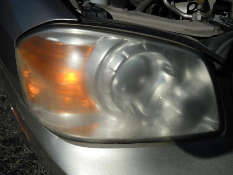 03 04 kia optima r. headlight outer low beam,lens is cloudy