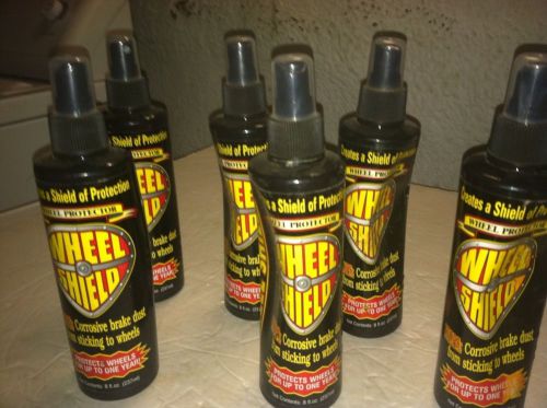 (6) bottles of wheel shield protective coating spray 8 oz. nos plastic dented.