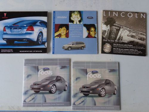 Lot of 5 auto owners manual supplements cd ford lincoln pontiac 2003 2004