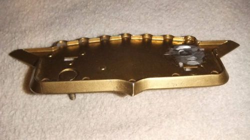 Original bezel for 1957 cadillac hood crest