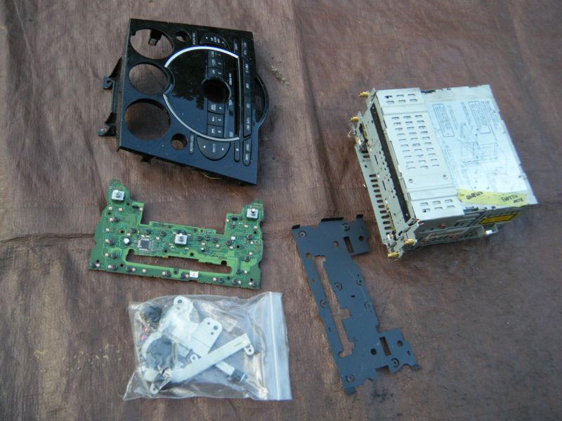 Mazda rx-8 rx8 13b rotary am/fm cd player stereo face plate, buttons, parts etc.