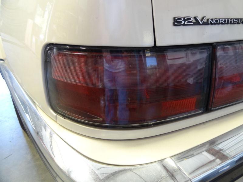 Tail light driver (left) 1997 cadillac seville