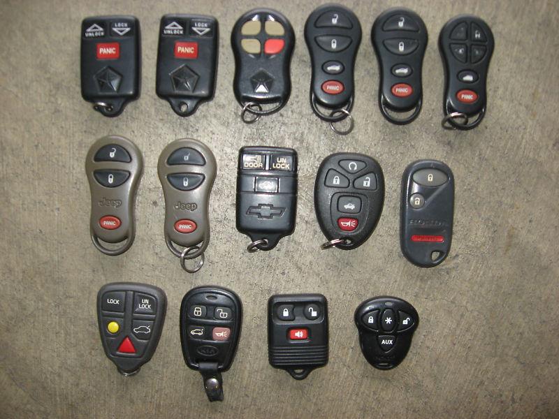 Lot of (15) keyless entry remotes fobs - jeep honda volvo kia ford gm dodge