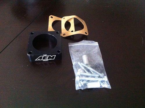 Aem throttle body spacer (jeep tj 4.0)