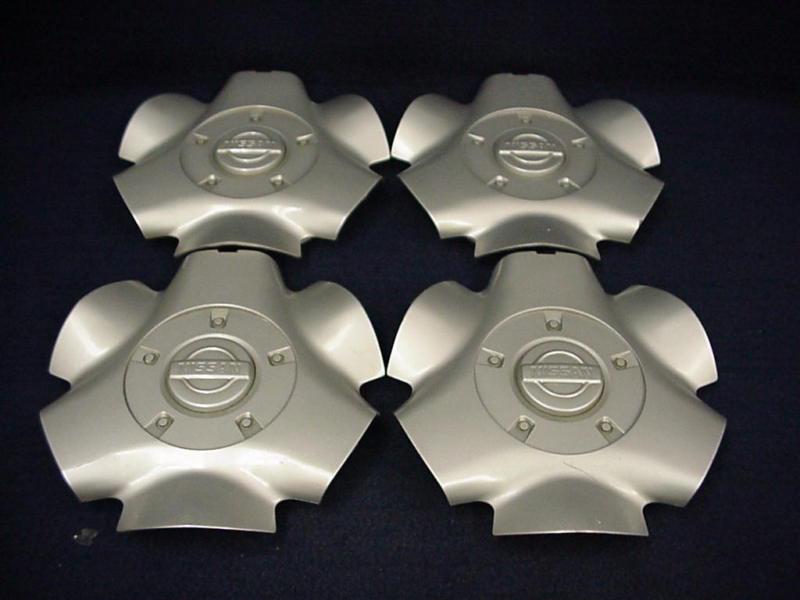 Nissan  pathfinder 99-02 silver center caps - set 4 - fits the 16" 6 spoke wheel