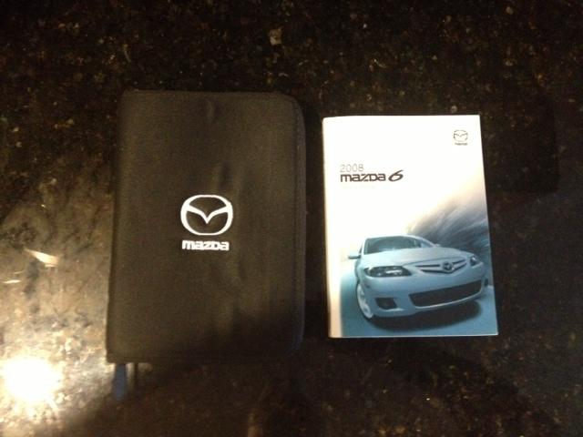 08-2008 mazda 6 owner's manual with cloth case with zipper.   like new!