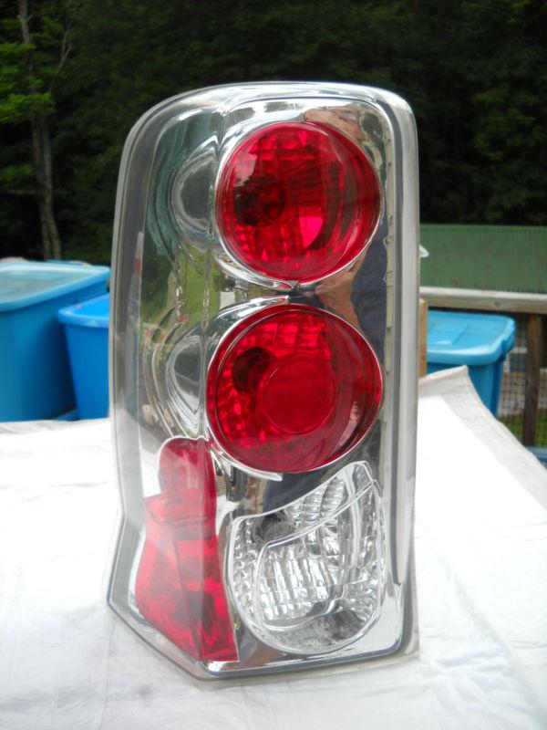 02-06 cadillac escalade euro clear chrome lh tail light rear brake lamp oem used