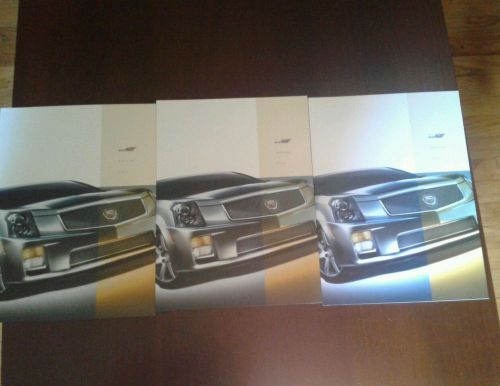 3 cadillac cts- v 2004 1st year sales brochures plus 1 cts sleeve new/mint