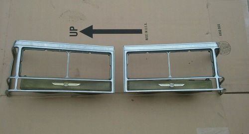 80-89 cadillac fleetwood deville headlight turn signal bezel, lh, rh. bezels oem