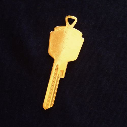 Gold plated studebaker crest key blank