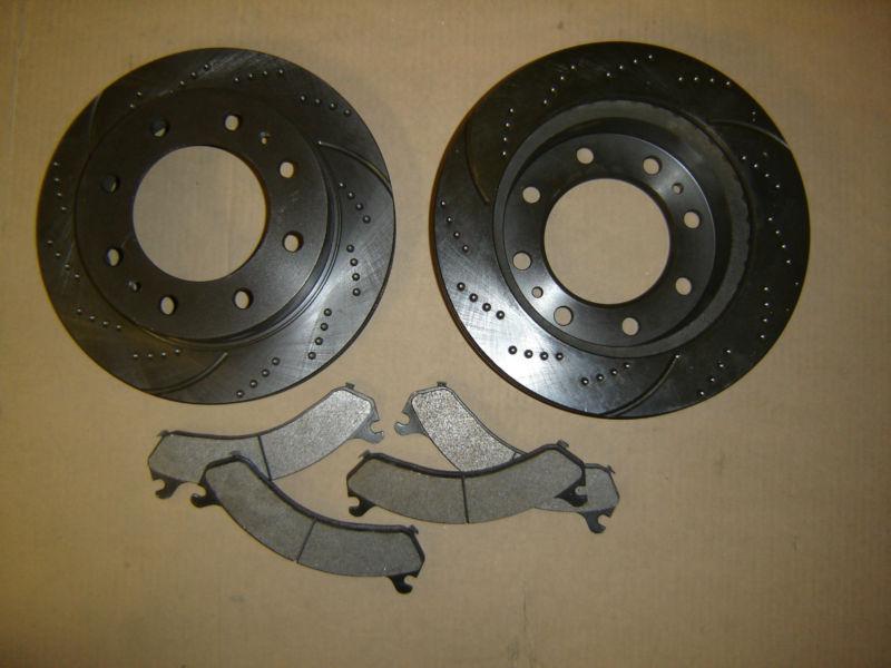 Rear  55057ds (2pc) dimpled slotted brake rotor (hub hole 4.63 inch) + brake pad