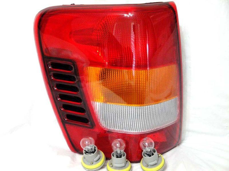 W/3 light bulbs/sockets 02-04 jeep grand cherokee rear tail light lamp l h new