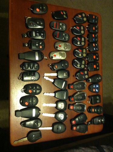 Lot of keyless enrty remotes and fobs 