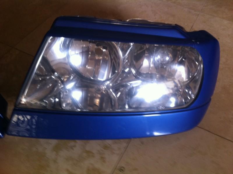 Cherokee grand cherokee limited  front head light 99 00 01 02 03 04