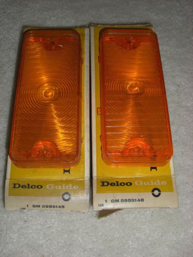 1967-68 chevy pickup l/h + r/h amber park lenses -early nos gm!
