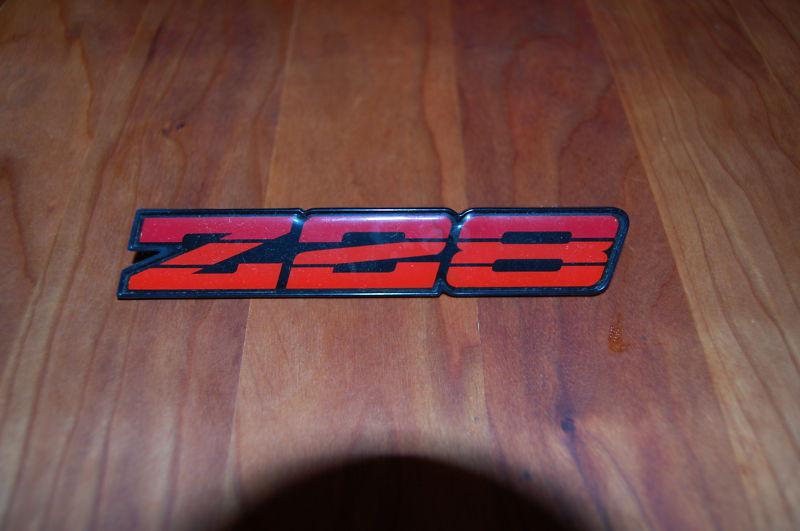 82-87 camaro z28 oem tri color red rocker emblem set