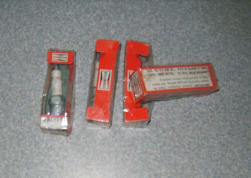 Four (4) champion spark plugs rbl15y4 nos