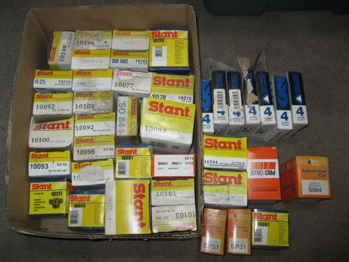 Lot of new old stock stant radiator oil filler caps, bosch spark plugs &amp; misc