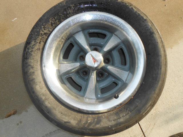 Pontiac gto rally wheel with the trim ring and center cap .15 inch..a