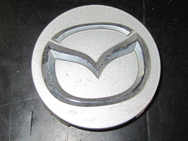 Mazda original equipment wheel center cap oe# 2477